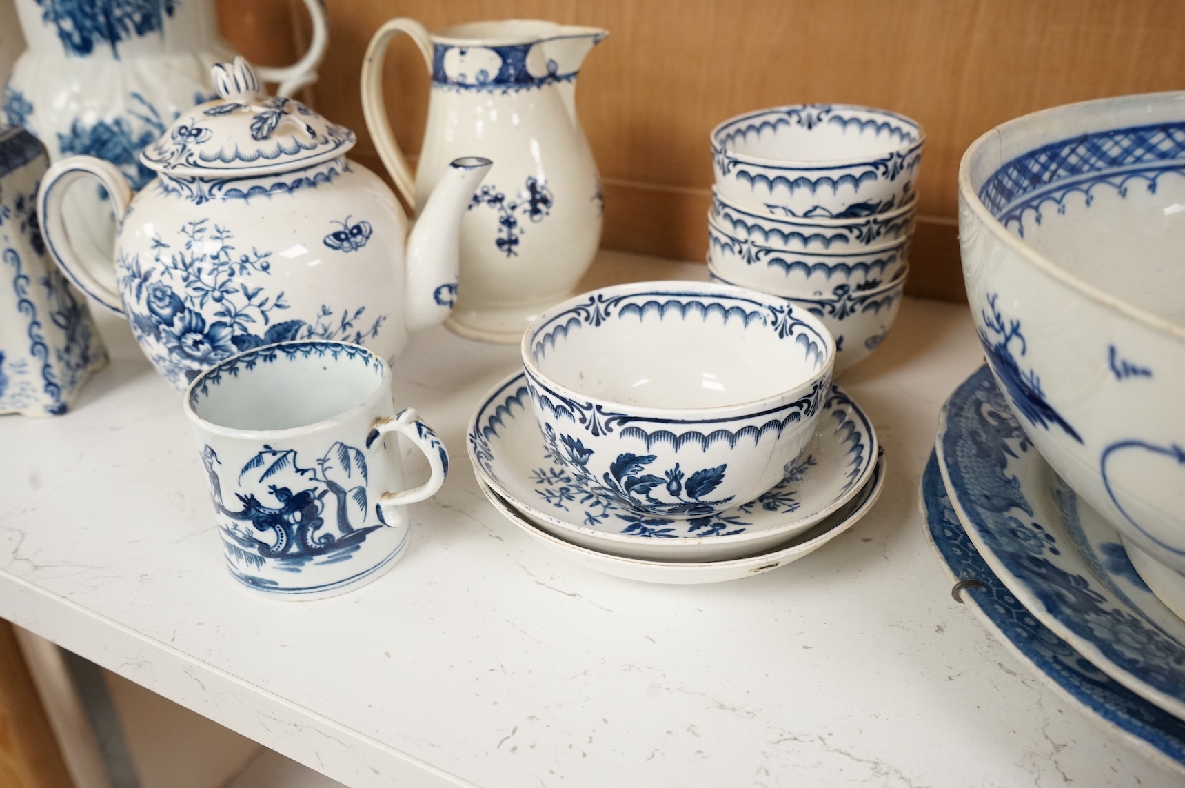 An 18th century blue and white Worcester jug and assorted Booths Worcester style tea wares, largest 24cm high